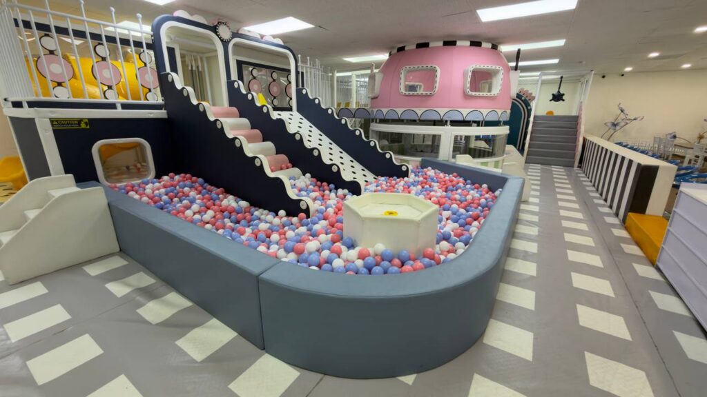 Ball pit, slides, and play structure at La La Land Burbank